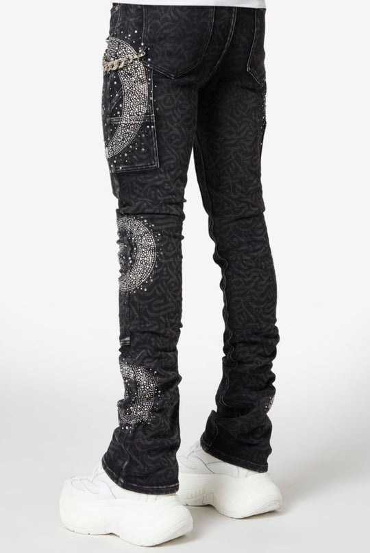 Black jeans with silver embellishments on a white background
