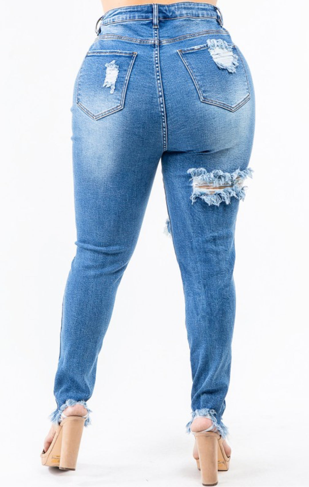 Blue distressed skinny jeans back view