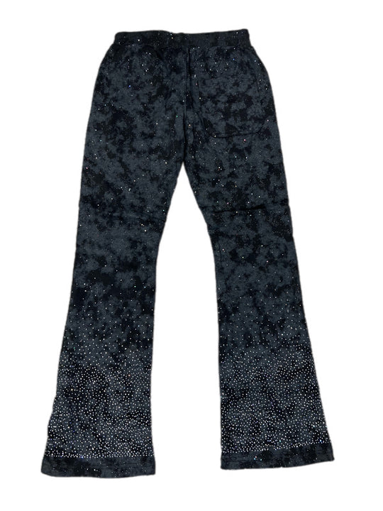 Black flared pants with a subtle pattern on a white background