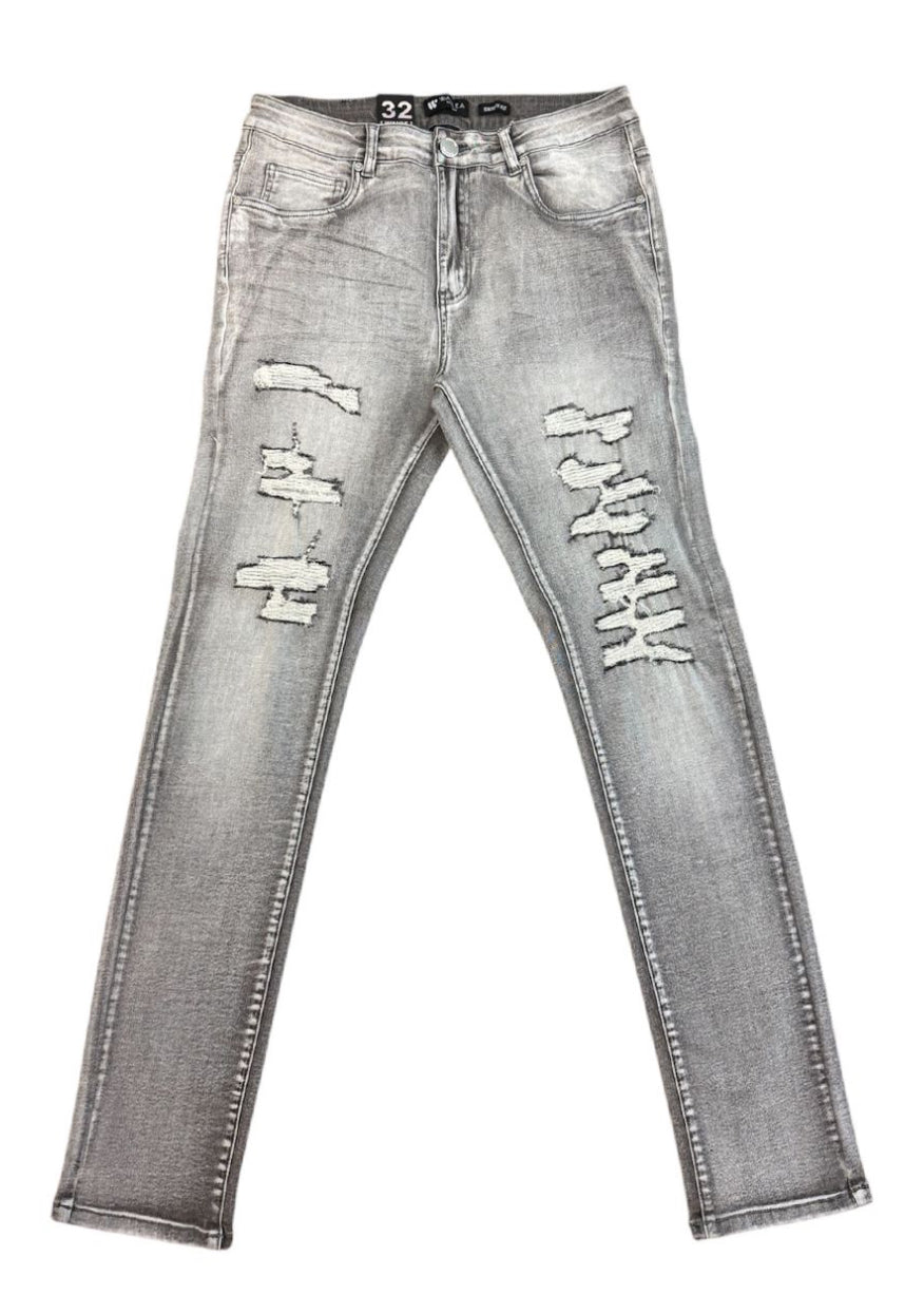 Gray distressed jeans on a white background