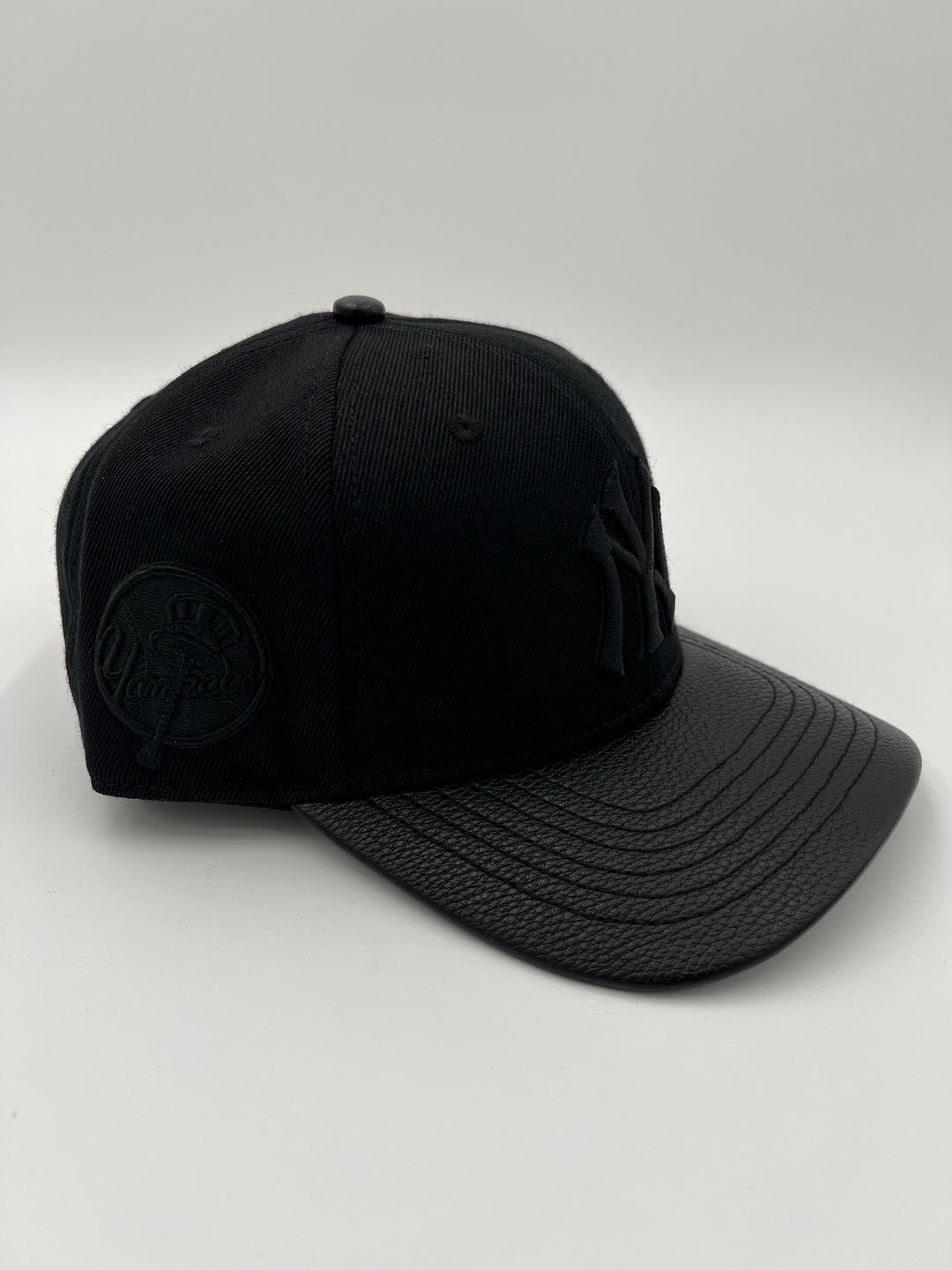 NY Yankees Pinched Leather Brim SnapBack Hat (Multiple Colors)