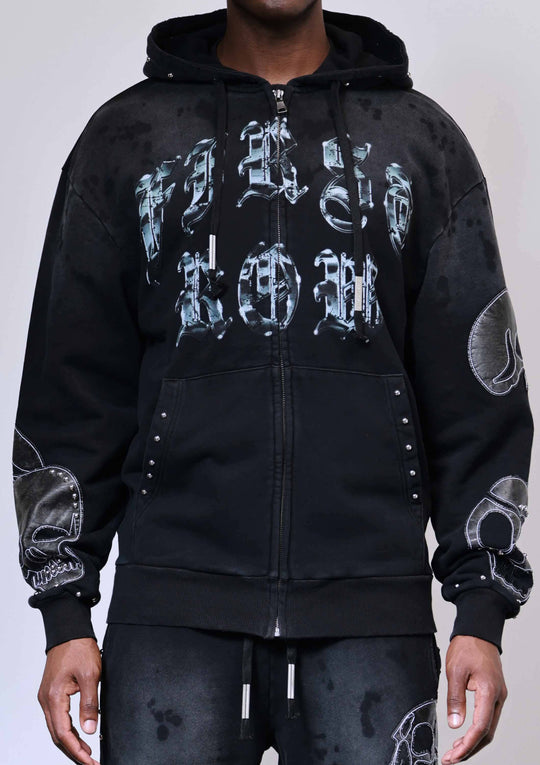 Black hoodie with white graphic designs on a plain background